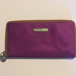 Purple Michael Kors zip around Wallet